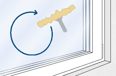 Fensterglas putzen mit kreisförmigen Bewegungen